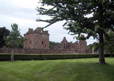 Tower house with West & North ranges to the right and walled garden in front