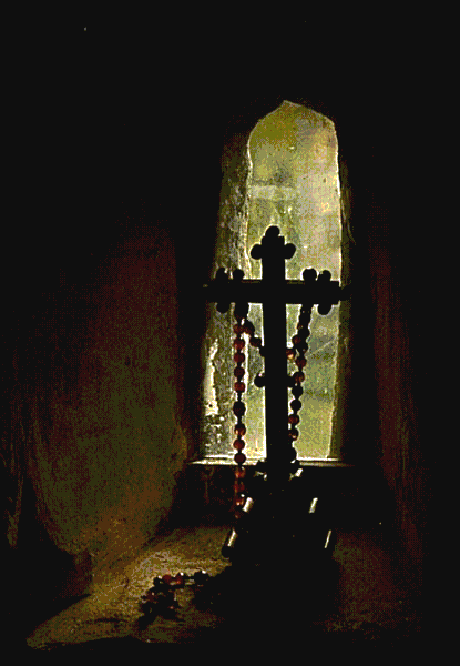 Rosary and crucifix in window recess
